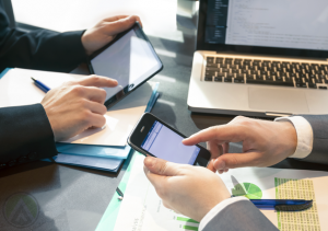 businessmen-hands-using-smartphone-tablet-laptop