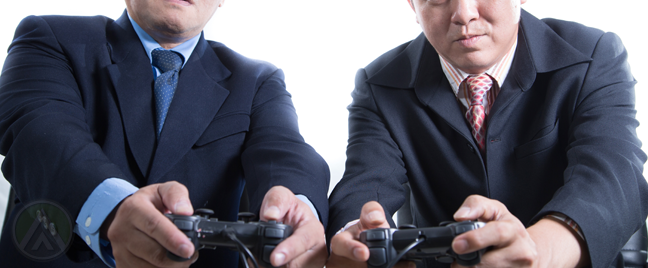 businessmen-playing-video-games-game-controller
