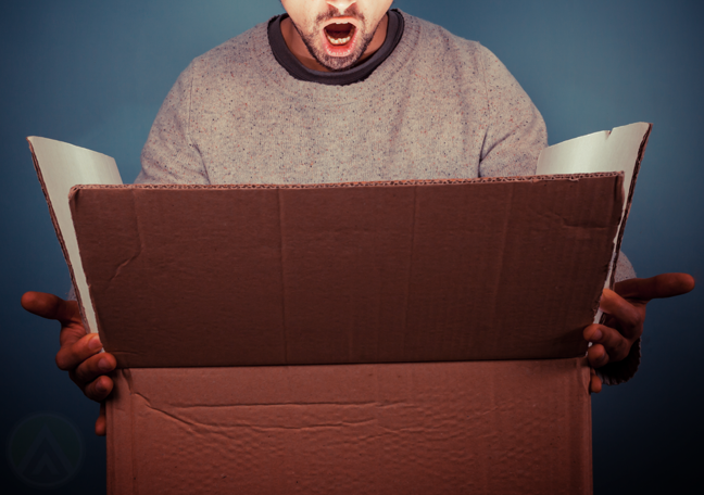 man-surprised-looking-into-big-box