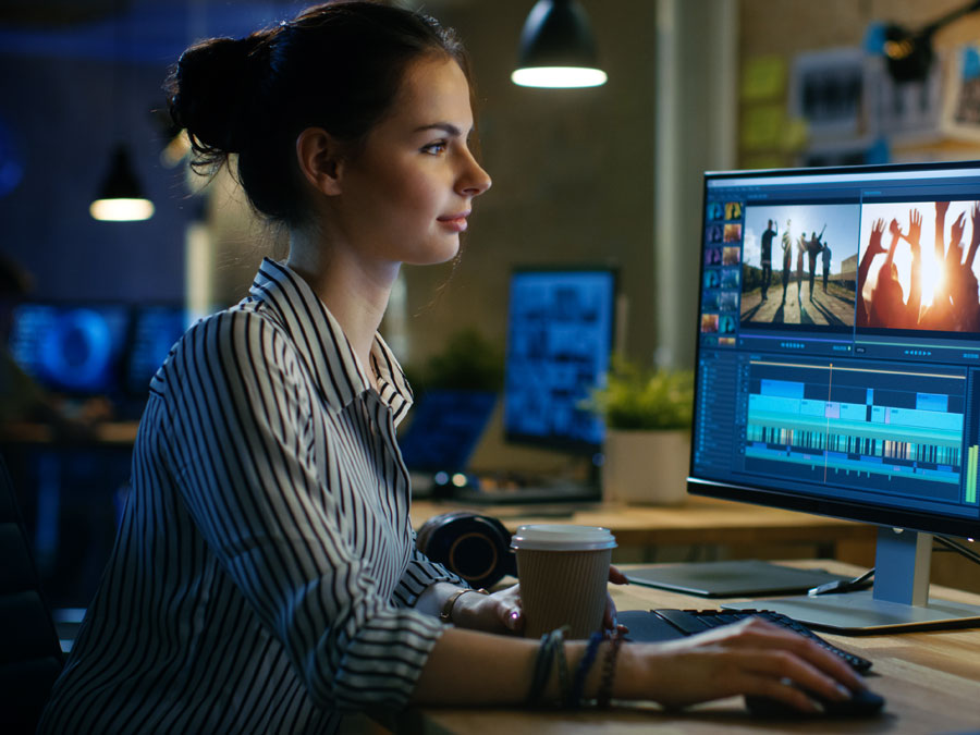 online video producer editing footages on computer