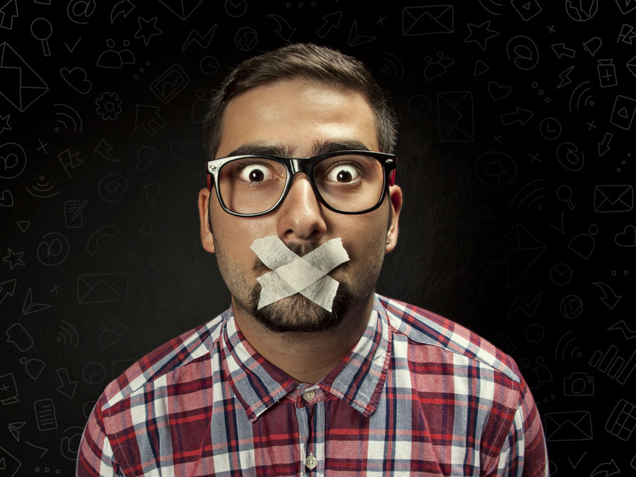 social media marketing staff taped mouth in the dark