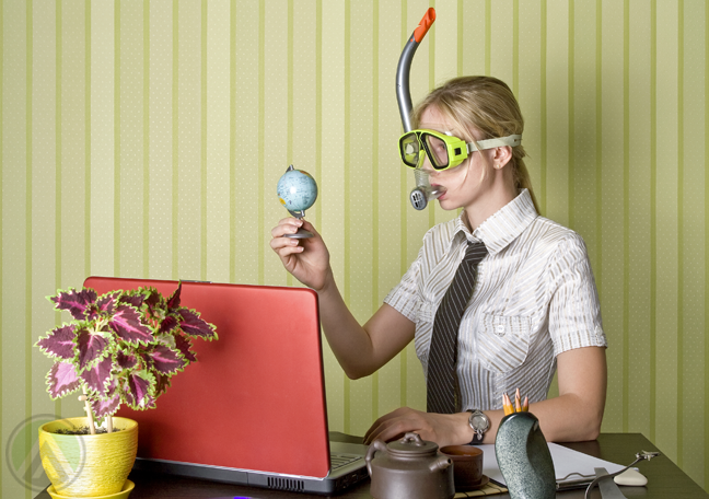 busy-female-office-staff-wearing-goggles-holding-small-globe