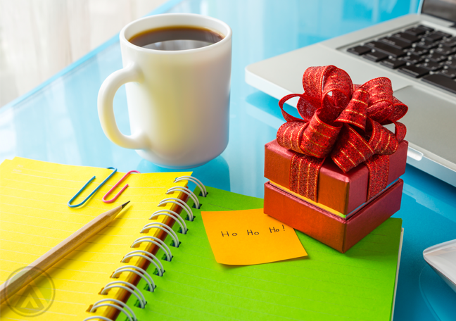 small-gift-on-colorful-office-table-laptop-coffee-yellow-green-notebook