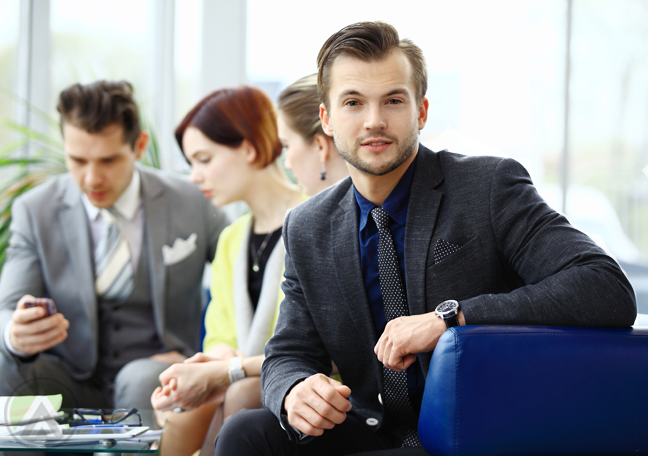 smiling-millennial-with-young-business-team-in-meeting-2