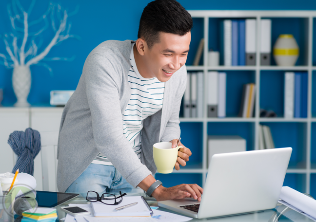 Asian-man-in-office-using-computer