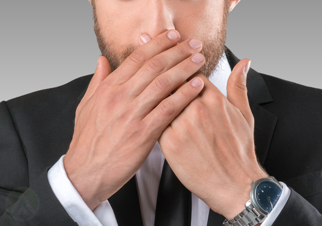 bearded-businessman-covering-mouth