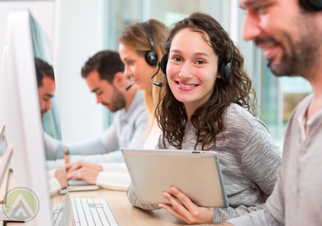 customer-service-agent-holding-laptop-tablet-with-smiling-call-center-team