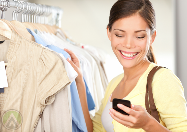 female-shopper-clothes-shopping-looking-at-smartphone