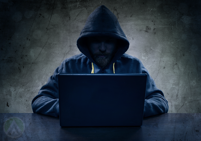 hacker-in-a-hoodie-in-the-dark
