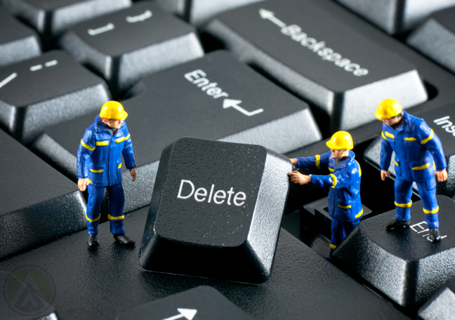 miniature-human-figures-fixing-keyboard-delete-button