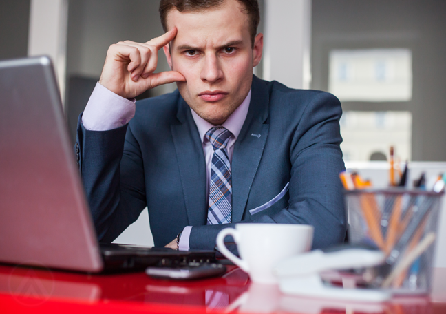 annoyed-businessman-at-work