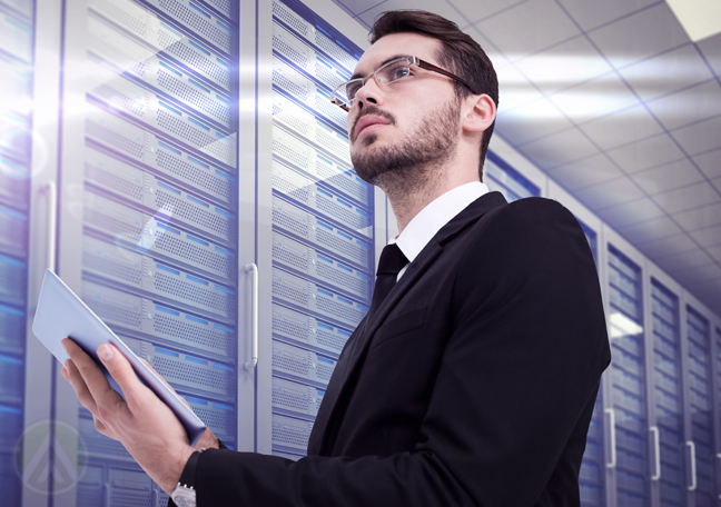 bearded-IT-expert-using-tablet-in-server-room