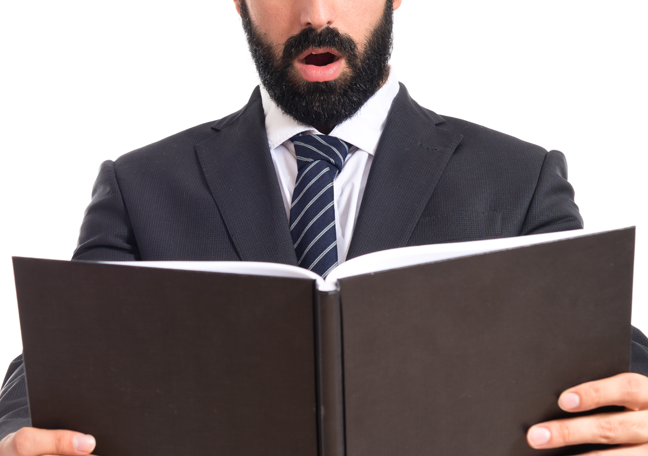 bearded-businessman-reading-book