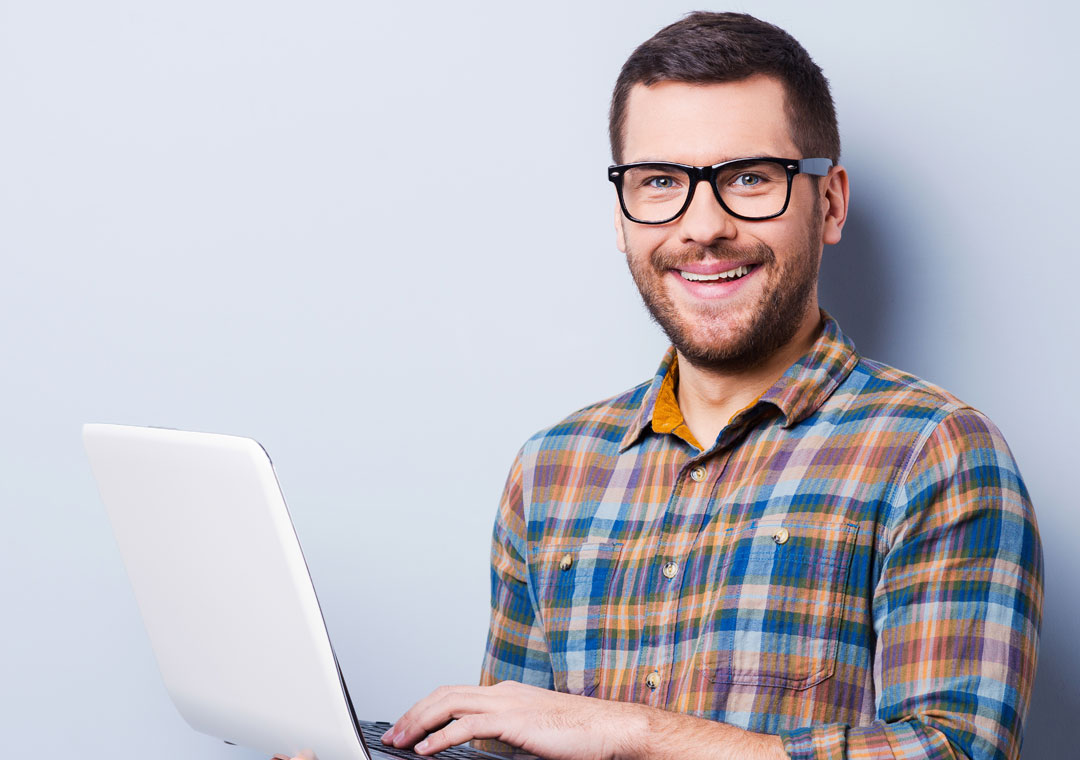 bilingual call centers agent smiling using laptop