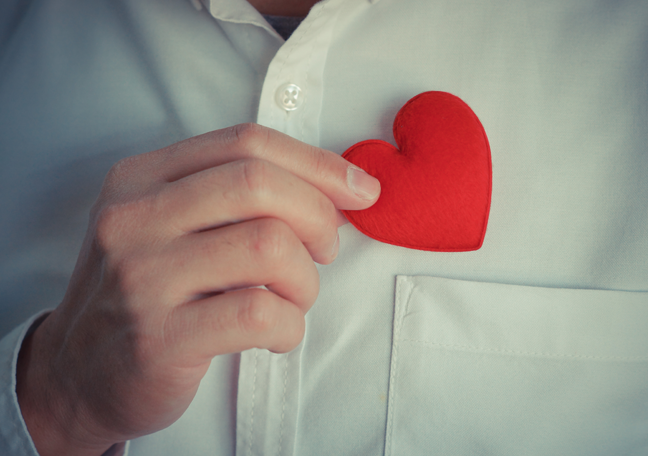 businessman-in-white-shirt-putting-plushie-heart-on-shirt-pocket