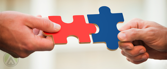 businessmen-hands-holding-fitting-jigsaw-puzzle-pieces
