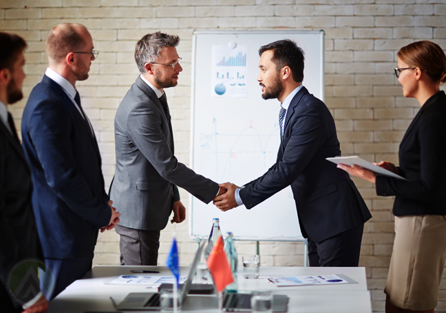 caucasian-businessman-shaking-hand-with-asian-business-partner