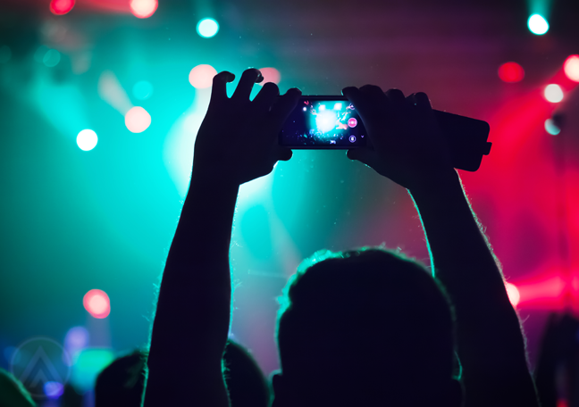 concert-attendee-holding-up-smartphone