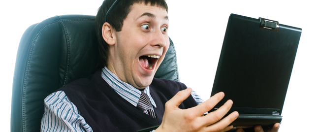 excited-businessman-reading-laptop