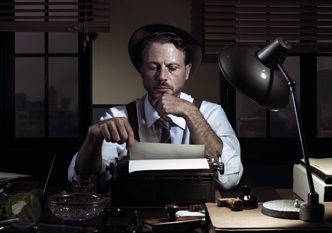 old-timey-writer-in-the-dark-with-typewriter