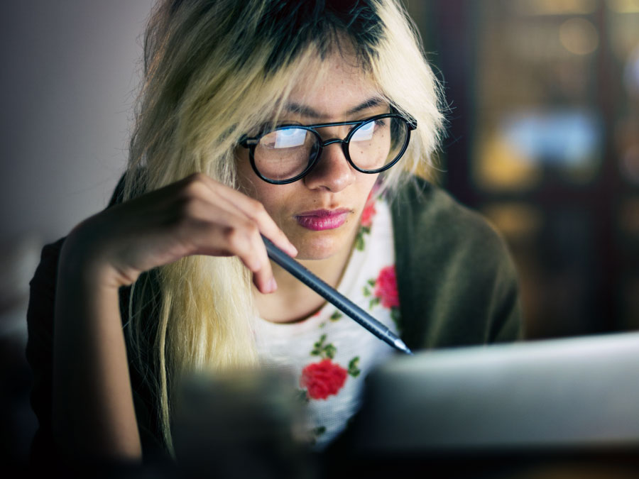 content moderator analyzing document on laptop