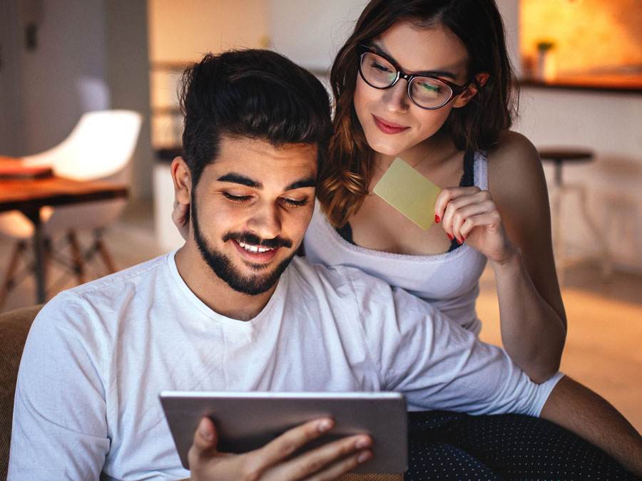 couple looking at tablet online shopping ecommerce