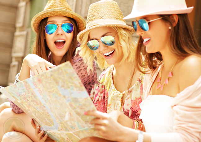 girls-in-summer-wear-chatting-looking-at-map