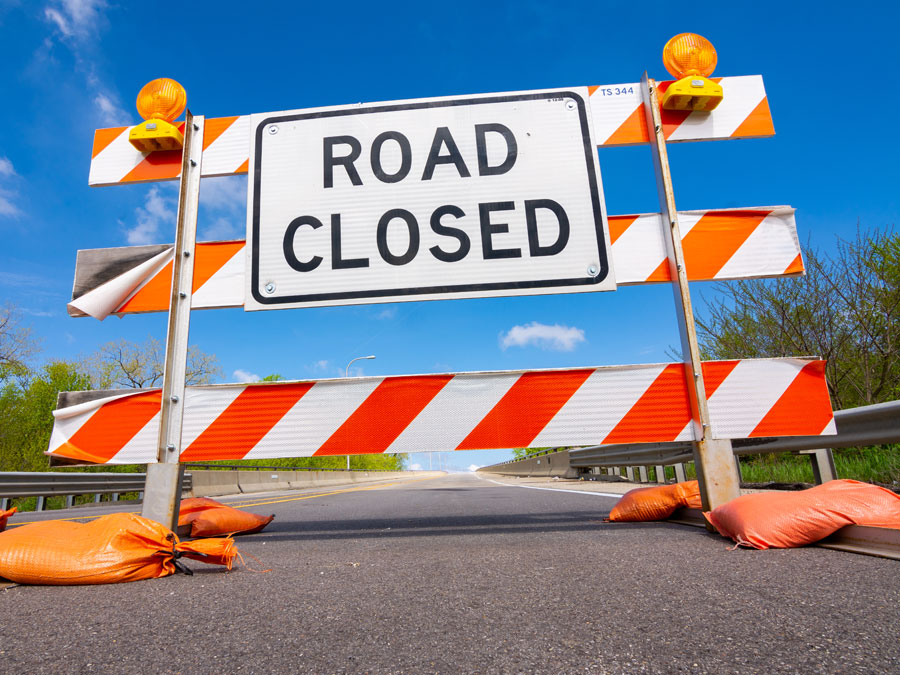 road closed sign in the middle of the road