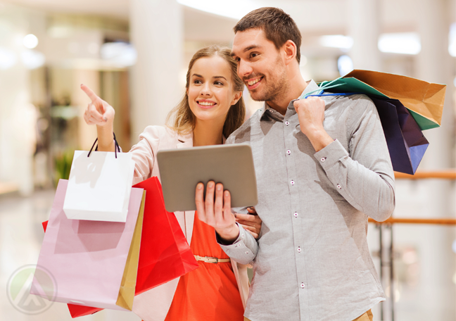 shopping-couple-at-the-mall-carrying-tablet