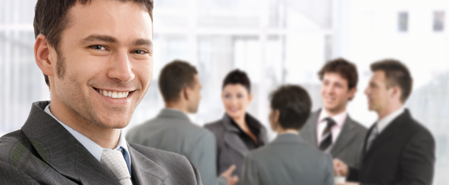 smiling-businessman-with-business-team-meeting-in-back
