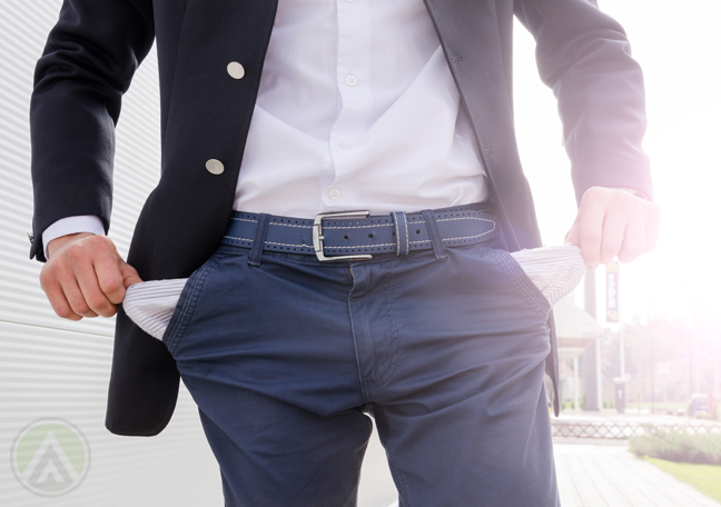 businessman-torso-pulling-out-empty-pockets