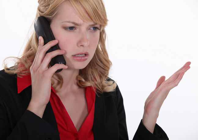 confused-female-business-executive-on-a-phone-call