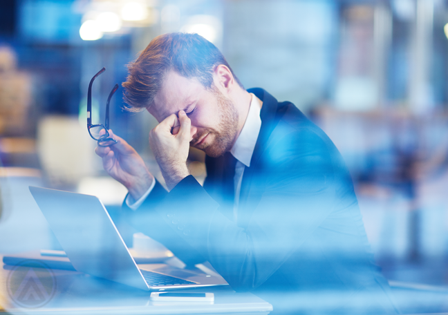 frustrated-male-employee-removed-eye-glasses