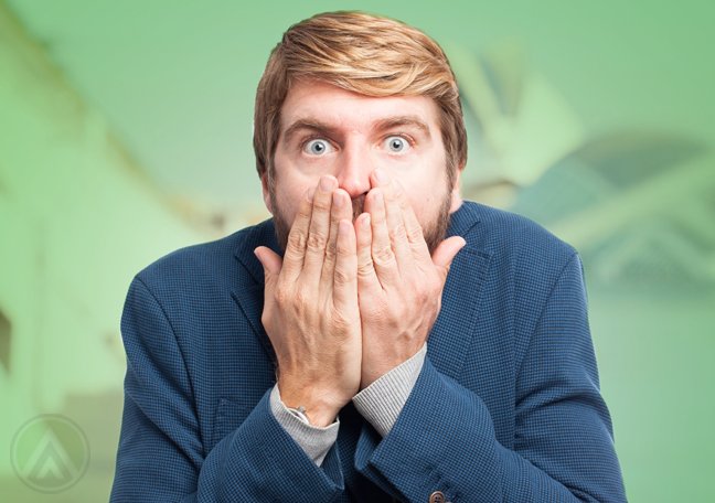 bearded-businessman-covering-mouth bearded-businessman-covering-mouth