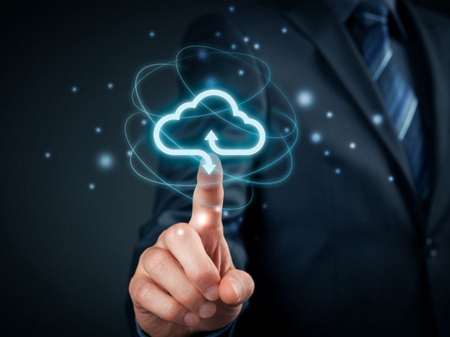 business executive IT manager pointing to cloud storage icon