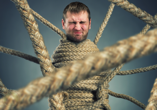 businessman-wrapped-in-ropes