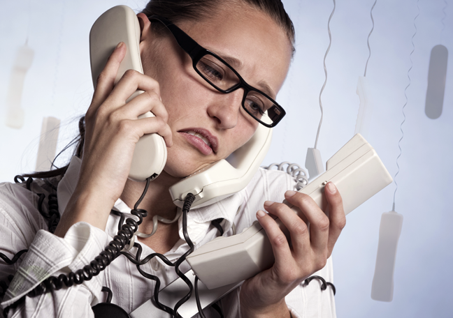 female-employee-confused-with-many-phones