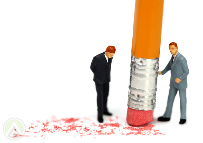 tiny-businessmen-figures-standing-by-pencil-eraser