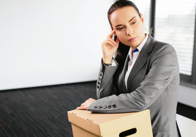 woman-in-empty-office-with-box
