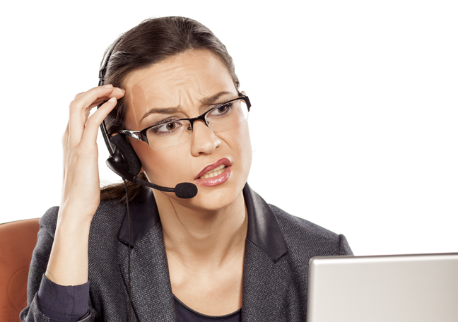 confused-call-center-agent-looking-laptop