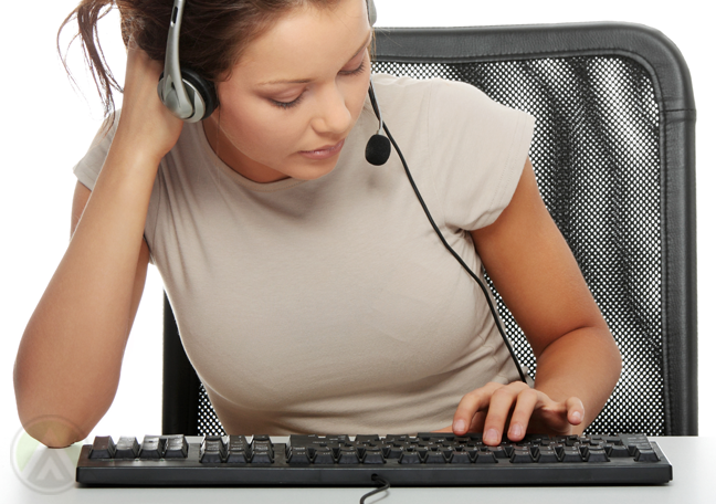female-call-center-agent-typing-on-keyboard