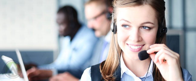 female-call-center-agent-with-coroworkers-in-back