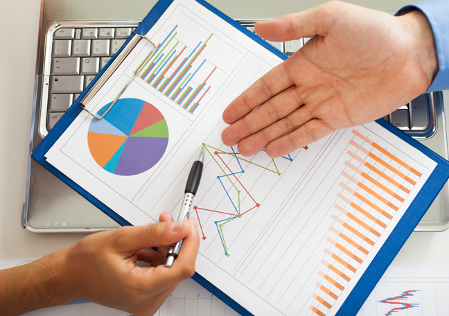 hands-holding-clipboard-reports-charts-graphs