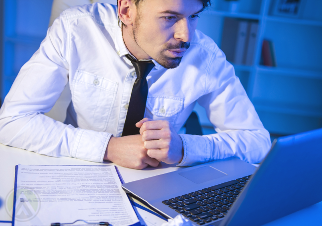 intrigued-employee-reading-laptop-clipboard