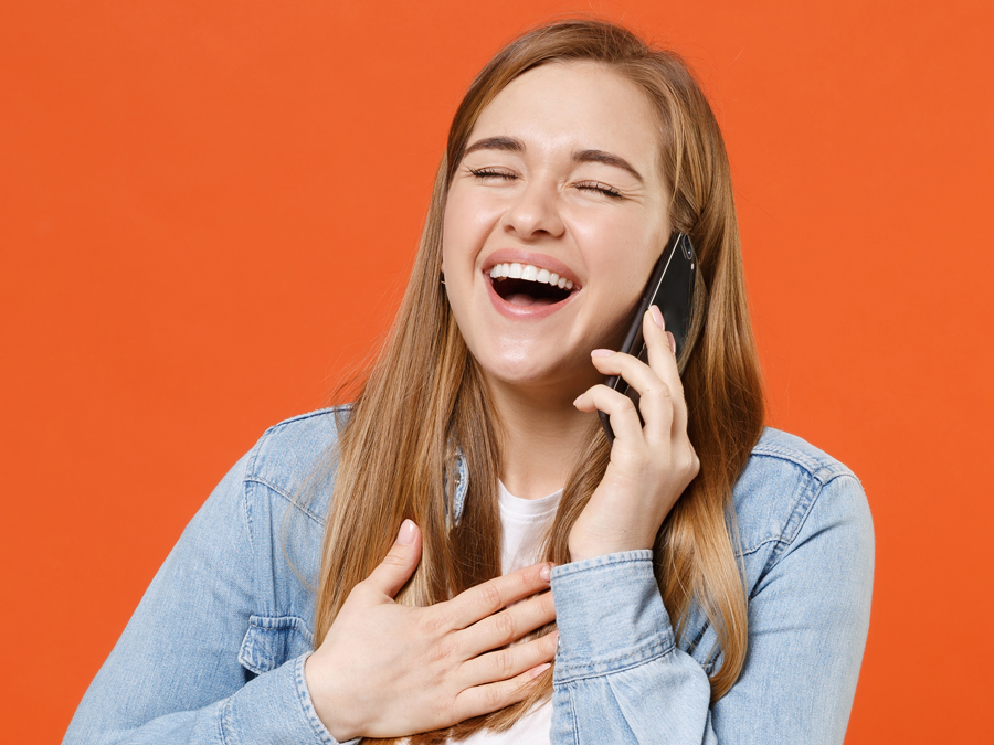 delighted woman on the phone