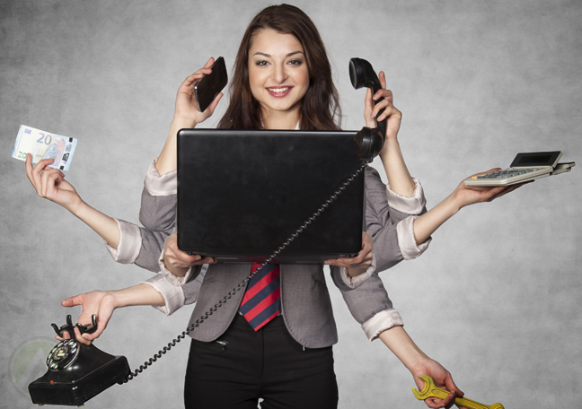 multitasking businesswoman using laptop