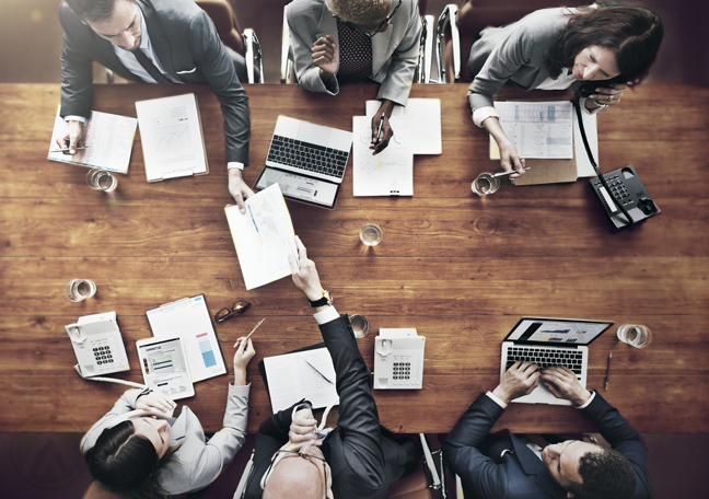 office departments working from across conference table