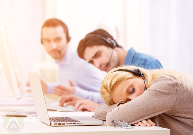 sleeping-female-customer-service-agent-call-center-coworkers-watching