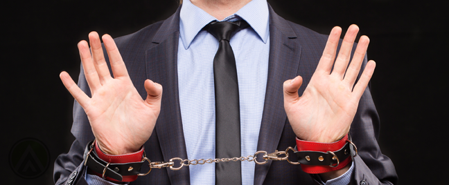 businessman held captive with handcuffs