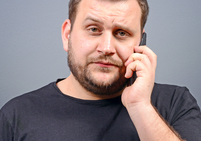 pissed man waiting on the phone